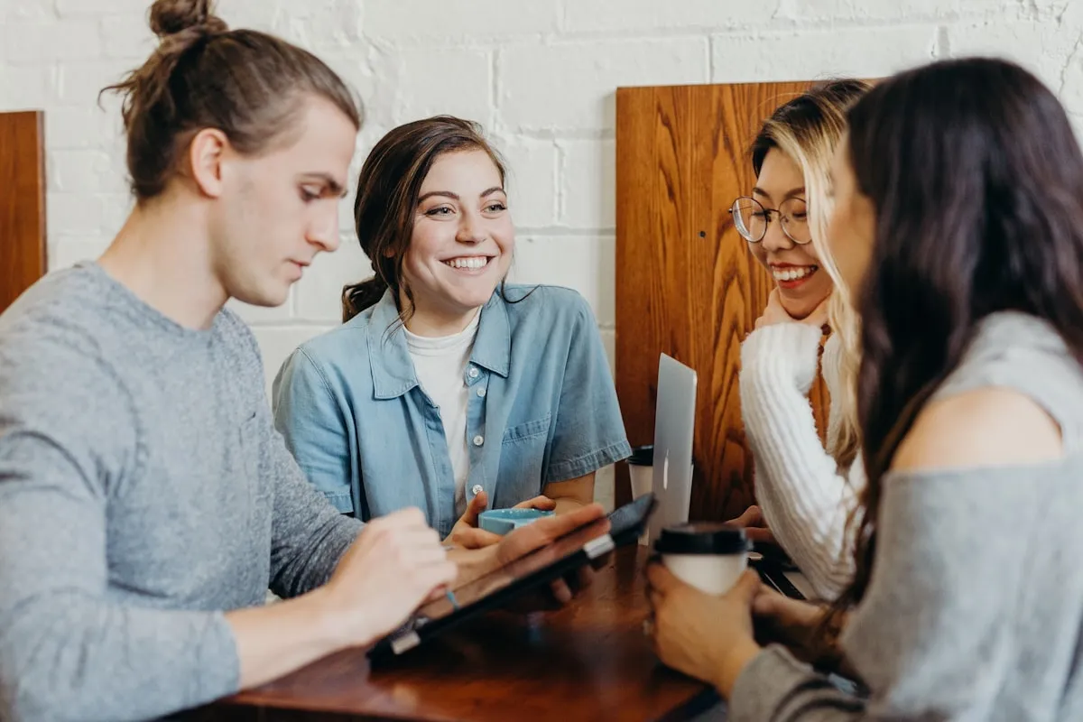 A small-business team laughing around a table