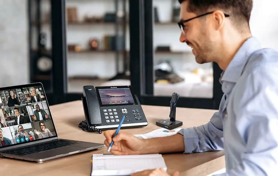 A Yealink IP desk phone with color display